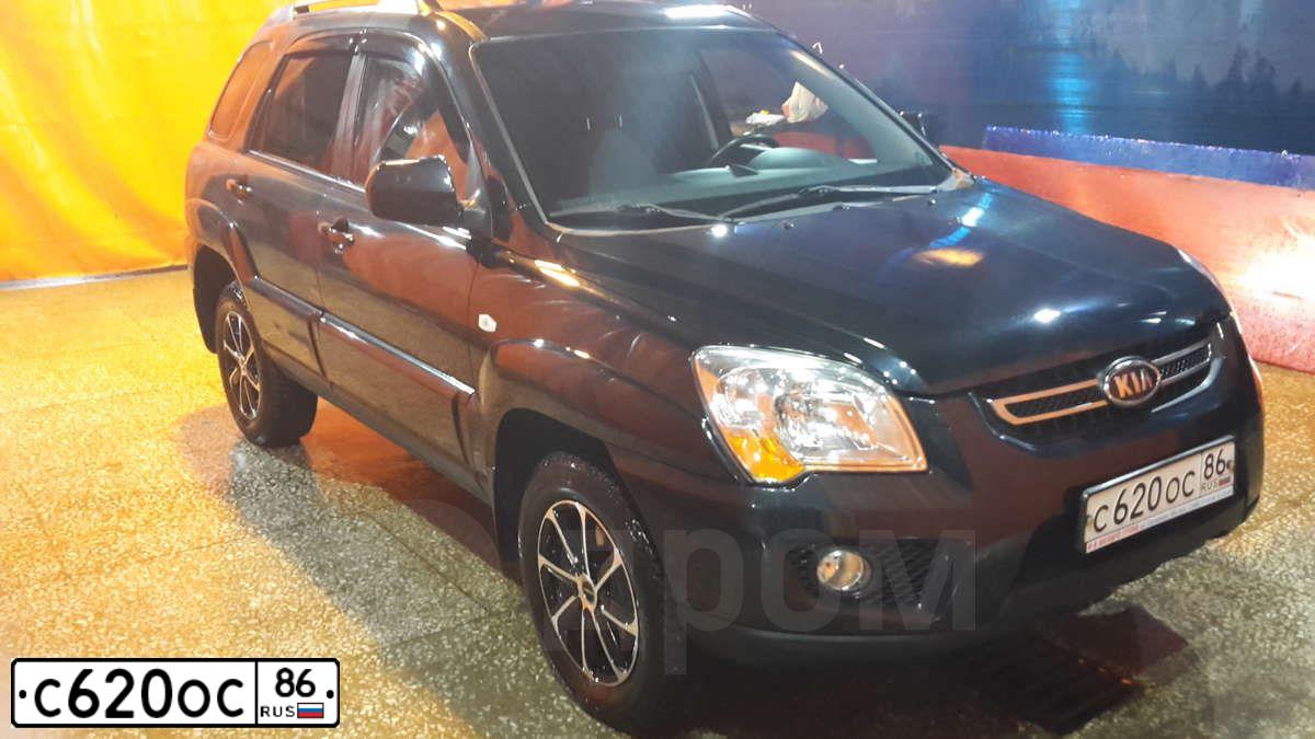 Фото автомобиля KIA SPORTAGE, 2010 — госномер Р774ТК154. Цвет: ЧЕРНЫЙ ПЕРЛАМУТР