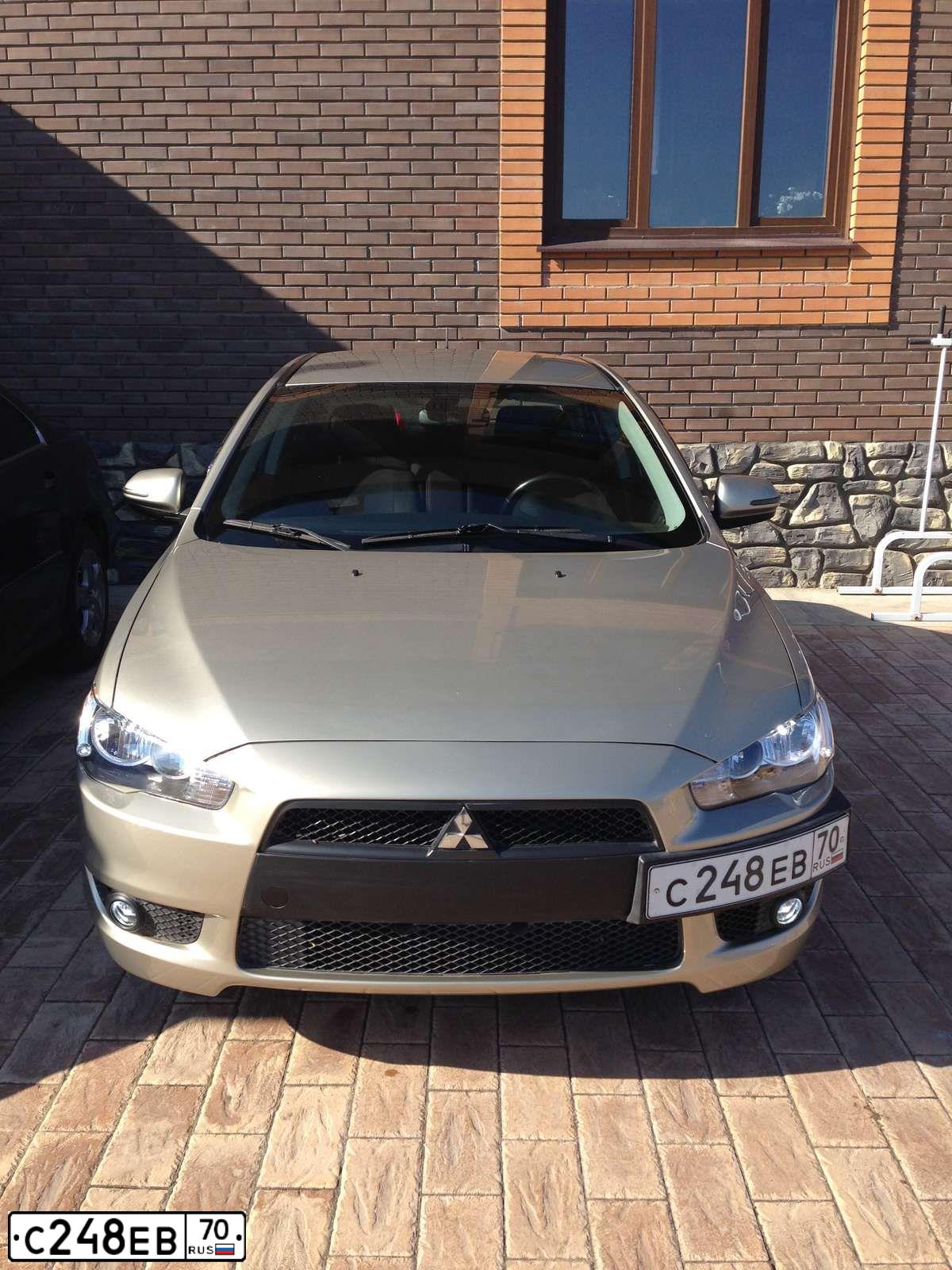 Фото автомобиля MITSUBISHI LANCER, 2008 — госномер С248ЕВ70. Цвет: БЕЖЕВЫЙ