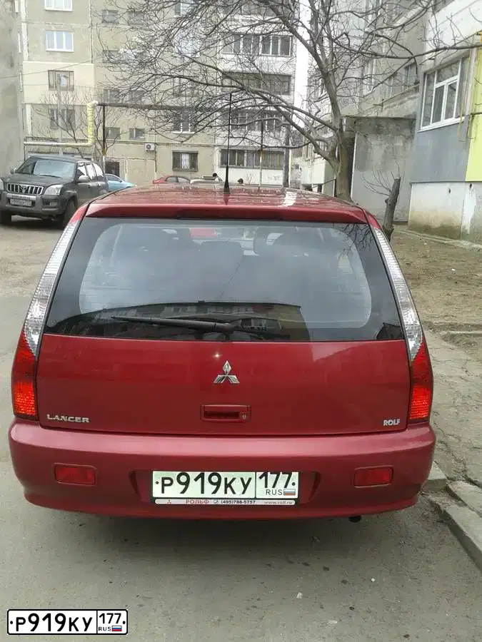 Фото автомобиля MITSUBISHI LANCER, 2006 — госномер В749АО92. Цвет: Красный