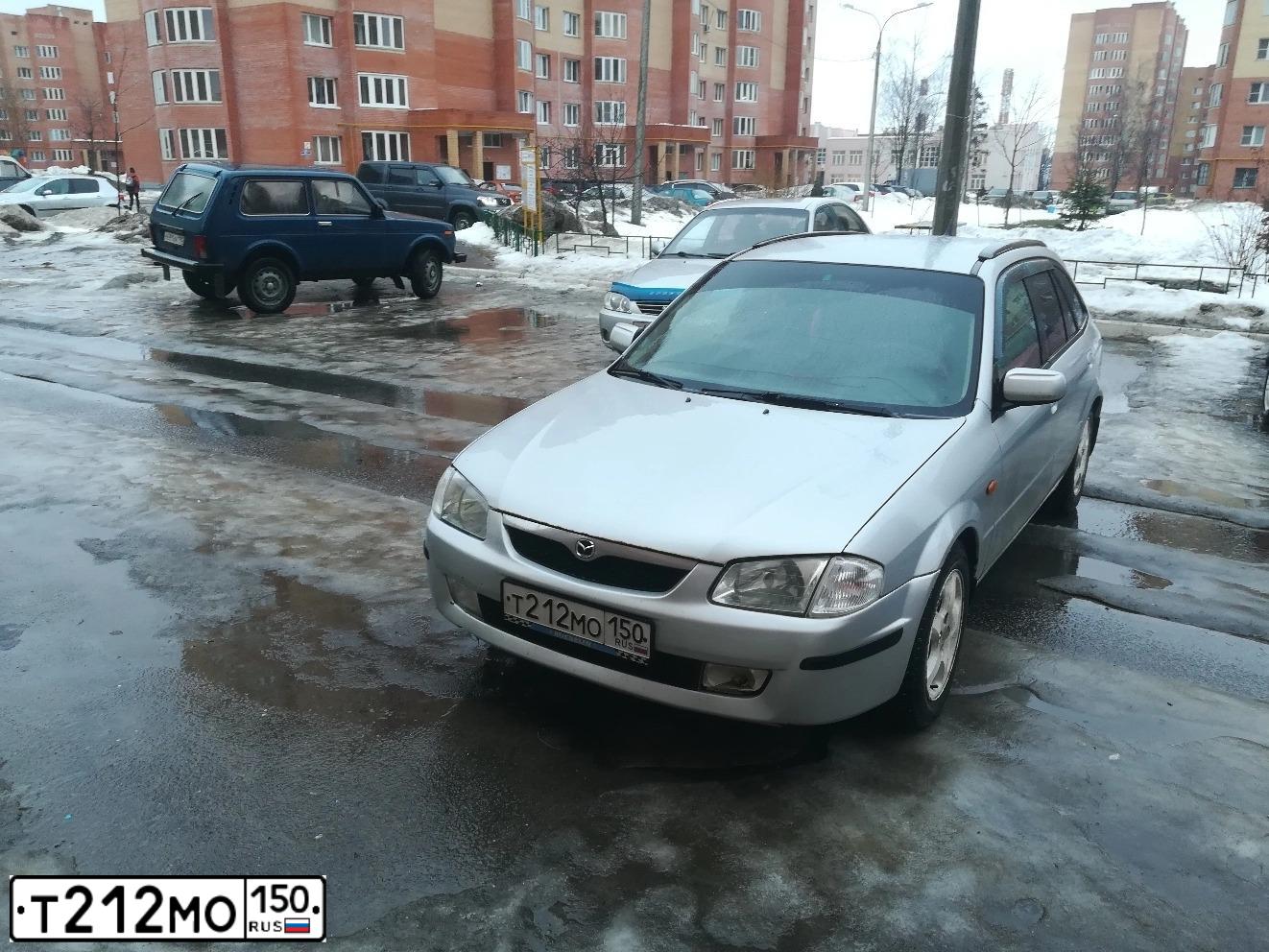 Фото автомобиля MAZDA 323, 2000 — госномер А690ММ252. Цвет: Серебристый