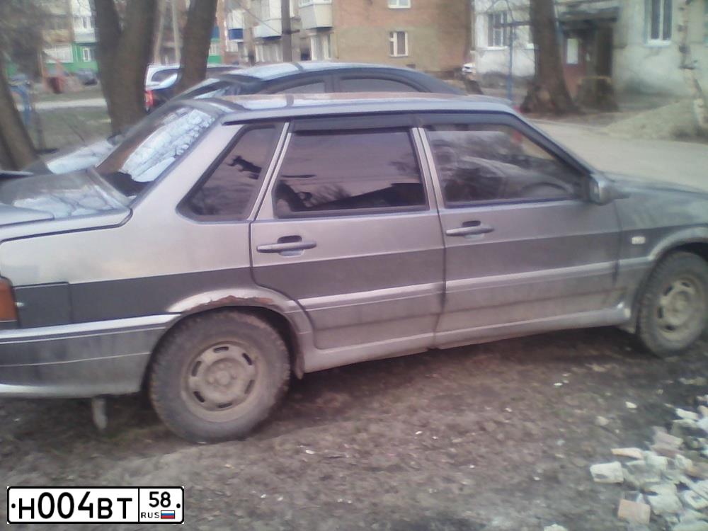 Фото автомобиля LADA 2115 SAMARA, 2005 — госномер Н004ВТ58. Цвет: СРЕДНИЙ СЕРО-ЗЕЛЕН
