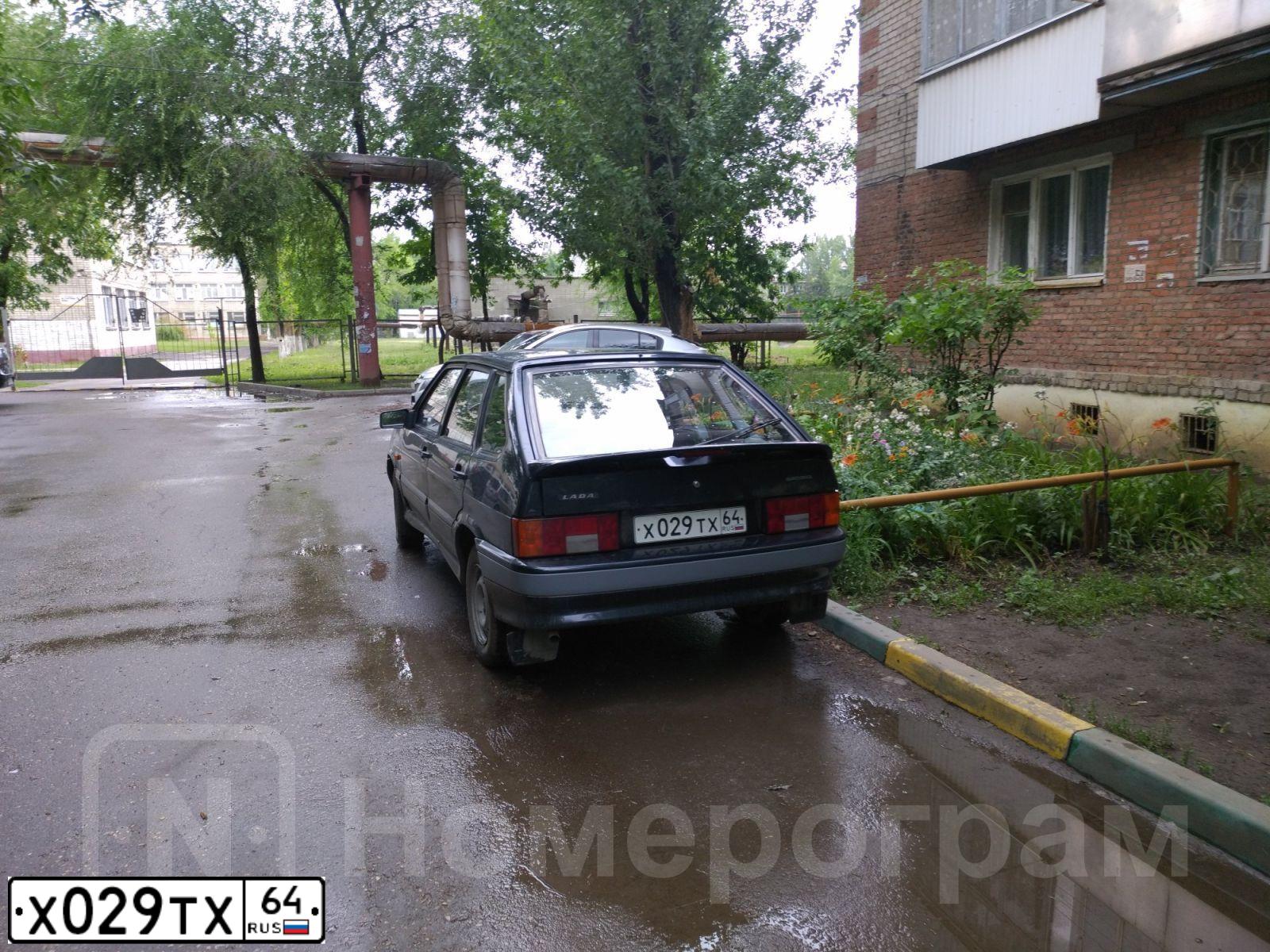 Фото автомобиля LADA 2114 SAMARA, 2005 — госномер Х029ТХ64. Цвет: ЧЕРНЫЙ