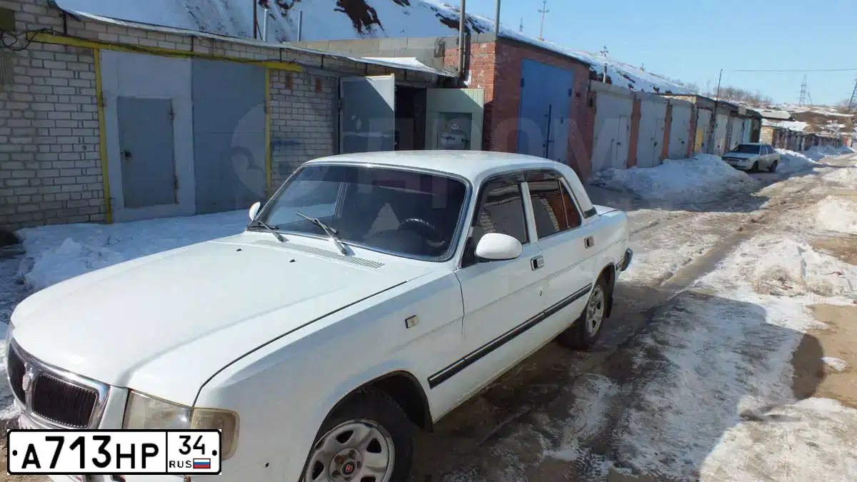 Фото автомобиля GAZ 3110 WOLGA, 1999 — госномер А713НР34. Цвет: БЕЛЫЙ