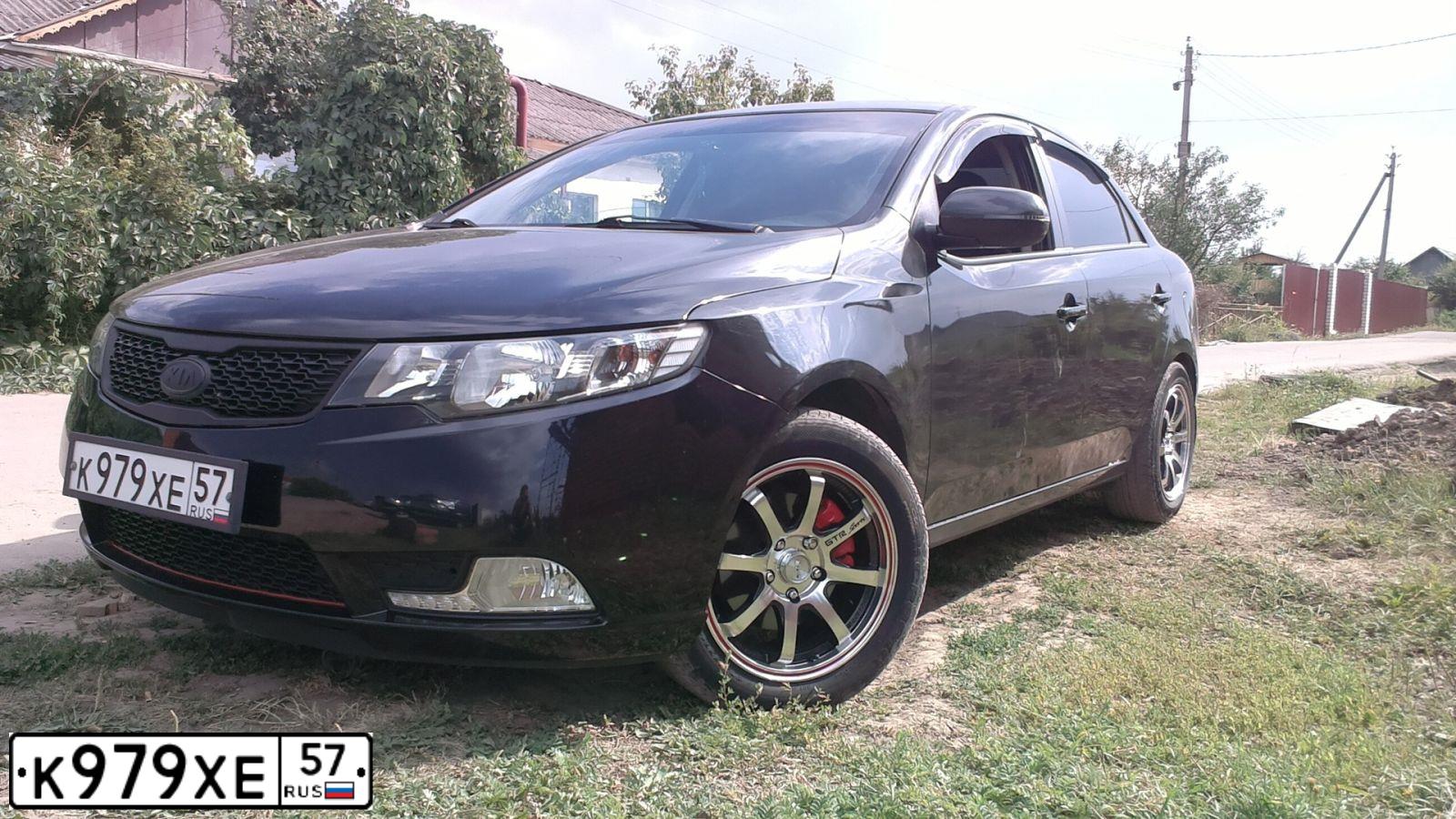 Фото автомобиля KIA CERATO, 2013 — госномер В917ЕР57. Цвет: ЧЕРНЫЙ