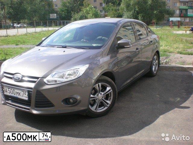 Фото автомобиля FORD FOCUS, 2012 — госномер А500МК74. Цвет: СЕРО-КОРИЧНЕВЫЙ