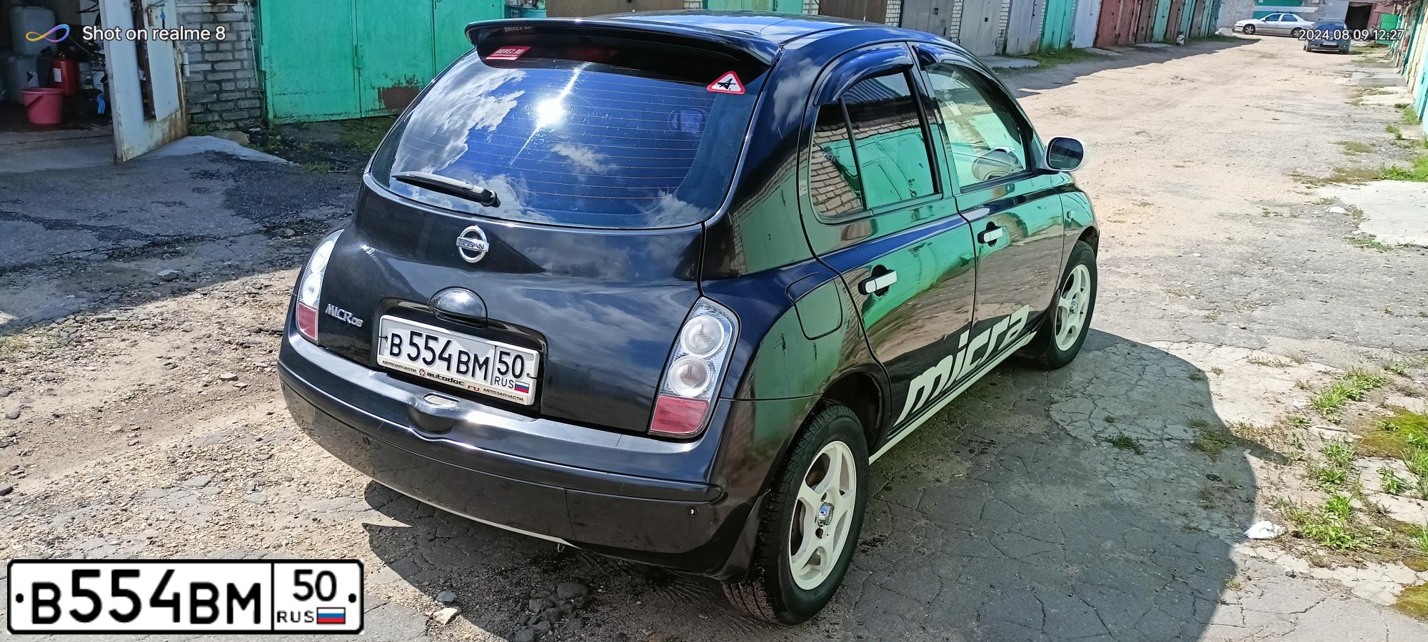 Фото автомобиля NISSAN MICRA, 2007 — госномер В554ВМ50. Цвет: ЧЕРНЫЙ
