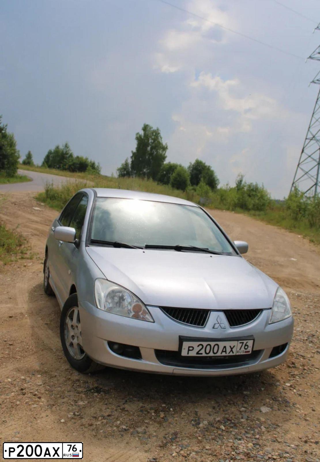 Фото автомобиля MITSUBISHI LANCER, 2004 — госномер Р989МО73. Цвет: СЕРЕБРИСТЫЙ