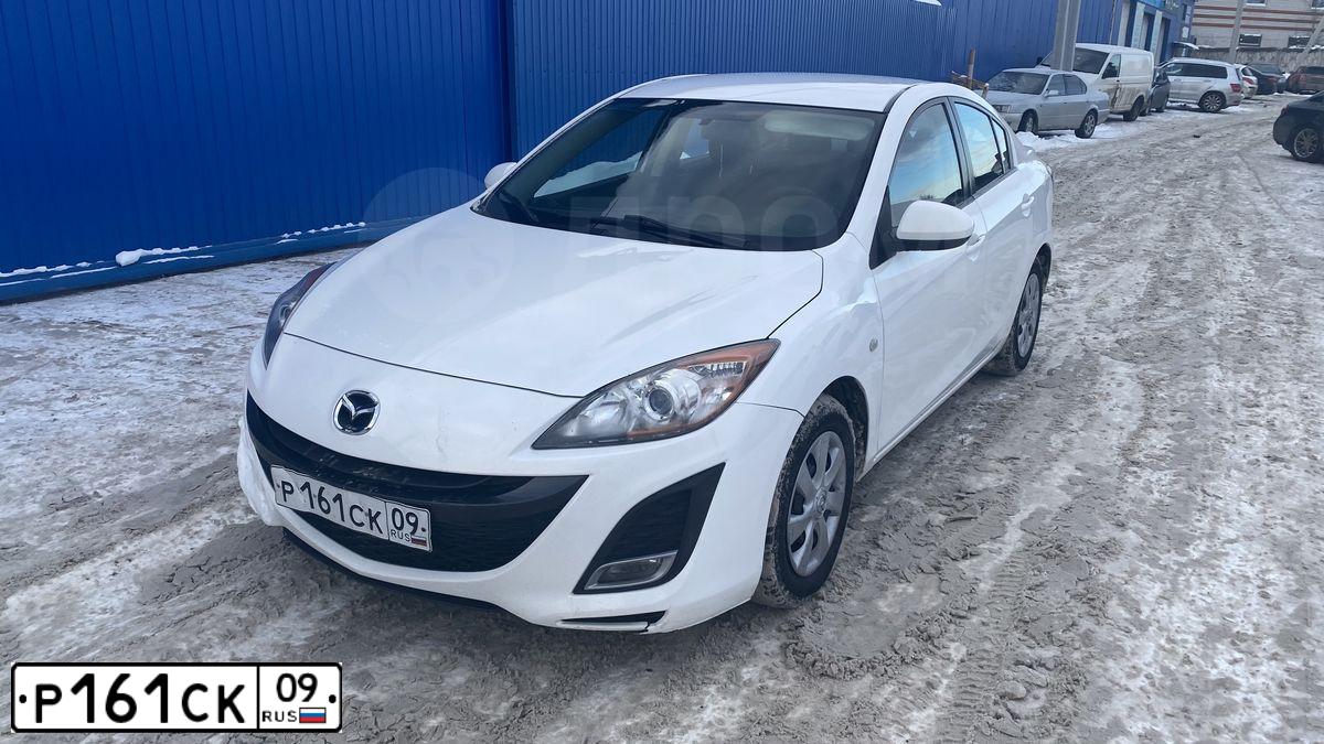 Фото автомобиля MAZDA 3, 2009 — госномер О838ТУ198. Цвет: Белый