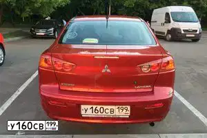 Фото автомобиля MITSUBISHI LANCER, 2008 — госномер К507РТ124. Цвет: Красный