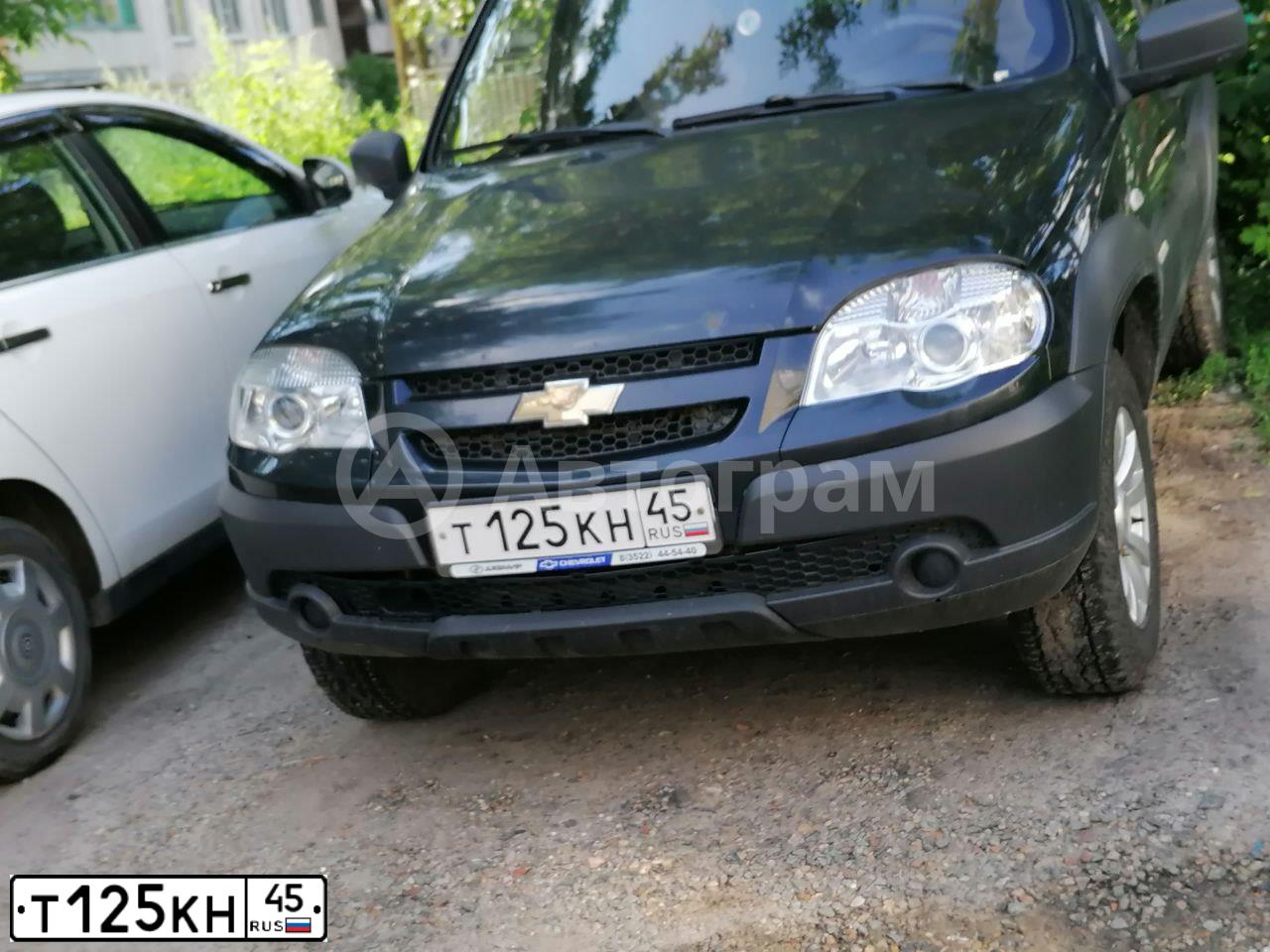 Фото автомобиля CHEVROLET NIVA, 2012 — госномер Т125КН45. Цвет: ЧЕРНО-СИНИЙ МЕТАЛЛИК