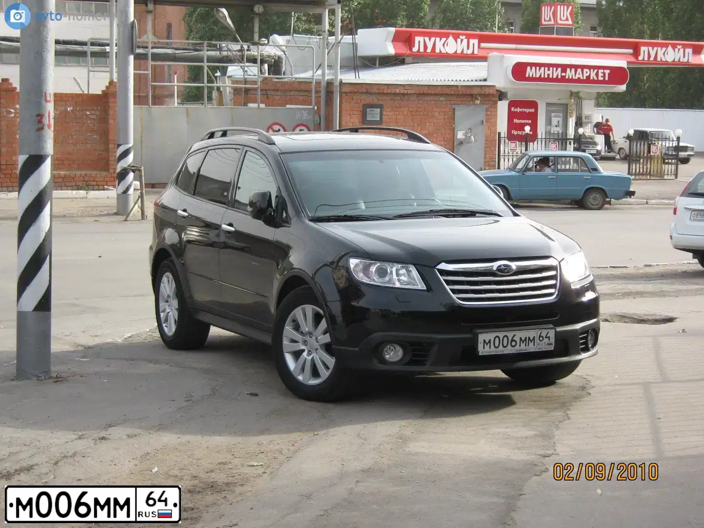 Фото автомобиля SUBARU B9 TRIBECA, 2008 — госномер Х133УЕ164. Цвет: ЧЕРНЫЙ