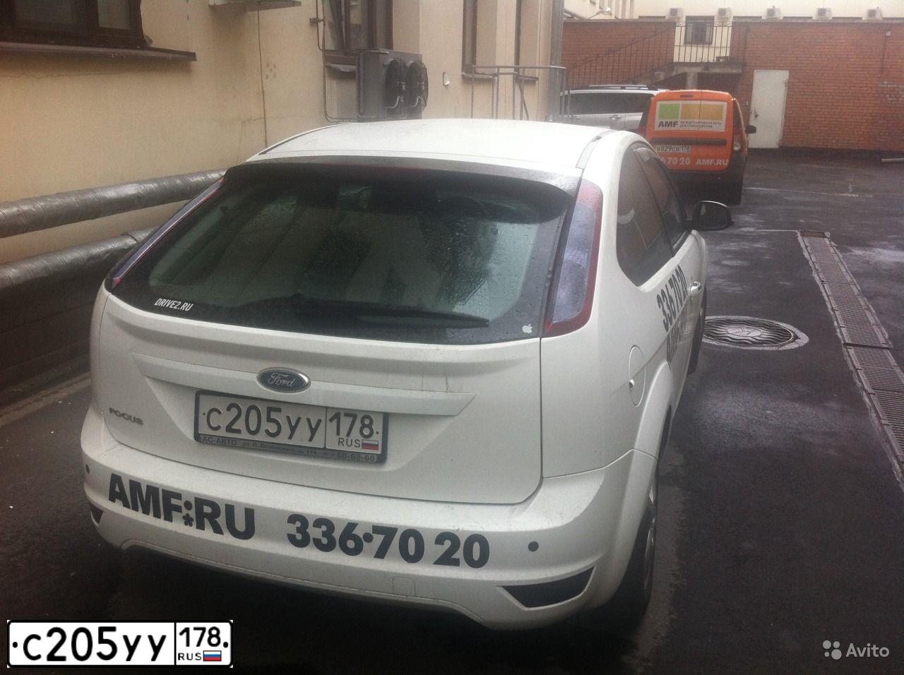 Фото автомобиля FORD FOCUS, 2010 — госномер Е167АС76. Цвет: Белый