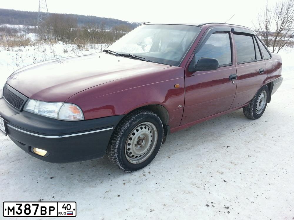 Фото автомобиля DAEWOO NEXIA, 2006 — госномер М387ВР40. Цвет: КРАСНЫЙ СПЕЛАЯ-ВИШНЯ