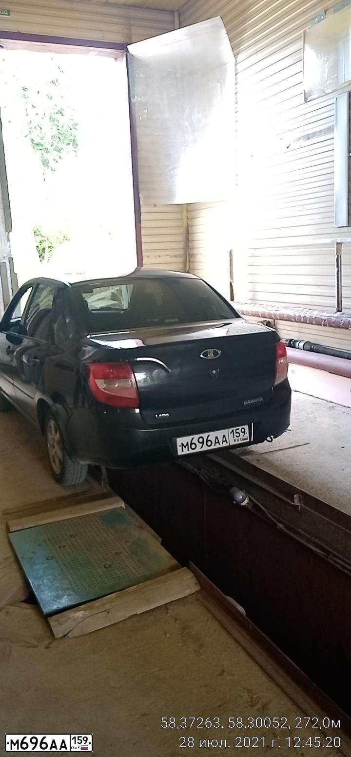 Фото автомобиля LADA 2190 GRANTA, 2013 — госномер В911ОР159. Цвет: ЧЕРНЫЙ