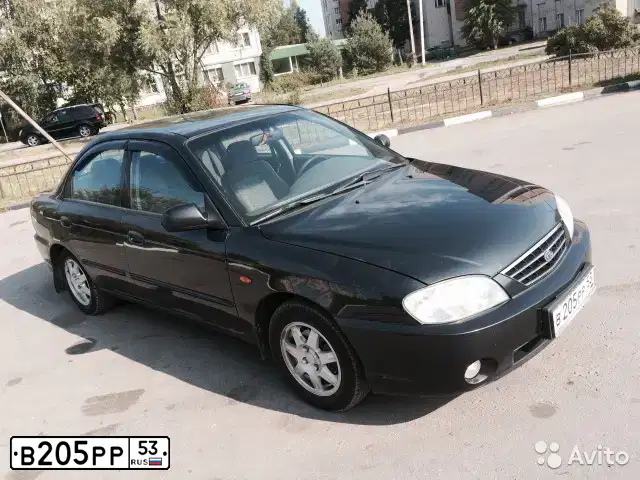 Фото автомобиля KIA SPECTRA, 2008 — госномер Х233МН37. Цвет: ЧЕРНЫЙ ЖЕМЧУГ