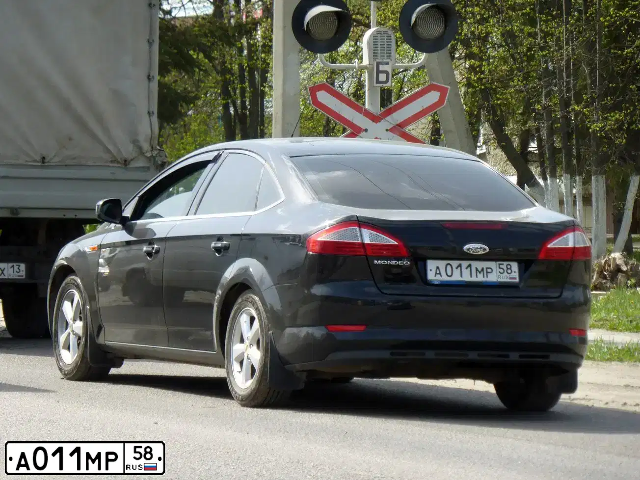 Фото автомобиля FORD FOCUS, 2010 — госномер А009МР58. Цвет: СЕРЕБРИСТЫЙ