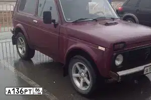 Фото автомобиля LADA 2121 NIVA, 2007 — госномер Е963КН70. Цвет: ТЕМНО-ВИШНЕВЫЙ