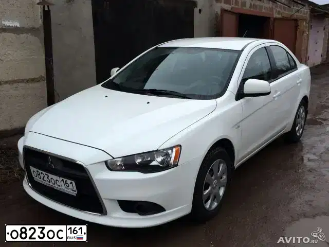 Фото автомобиля MITSUBISHI LANCER, 2012 — госномер Т761КМ116. Цвет: Белый