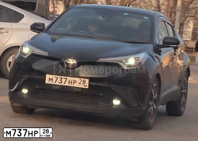 Фото автомобиля TOYOTA C-HR TOYOTA C-HR, 2019 — госномер М737НР28. Цвет: Черный