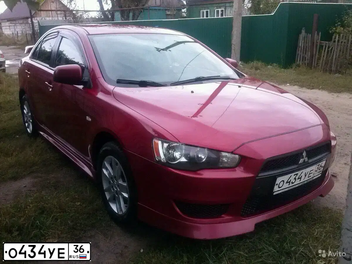 Фото автомобиля MITSUBISHI LANCER, 2008 — госномер Е066МТ164. Цвет: Красный