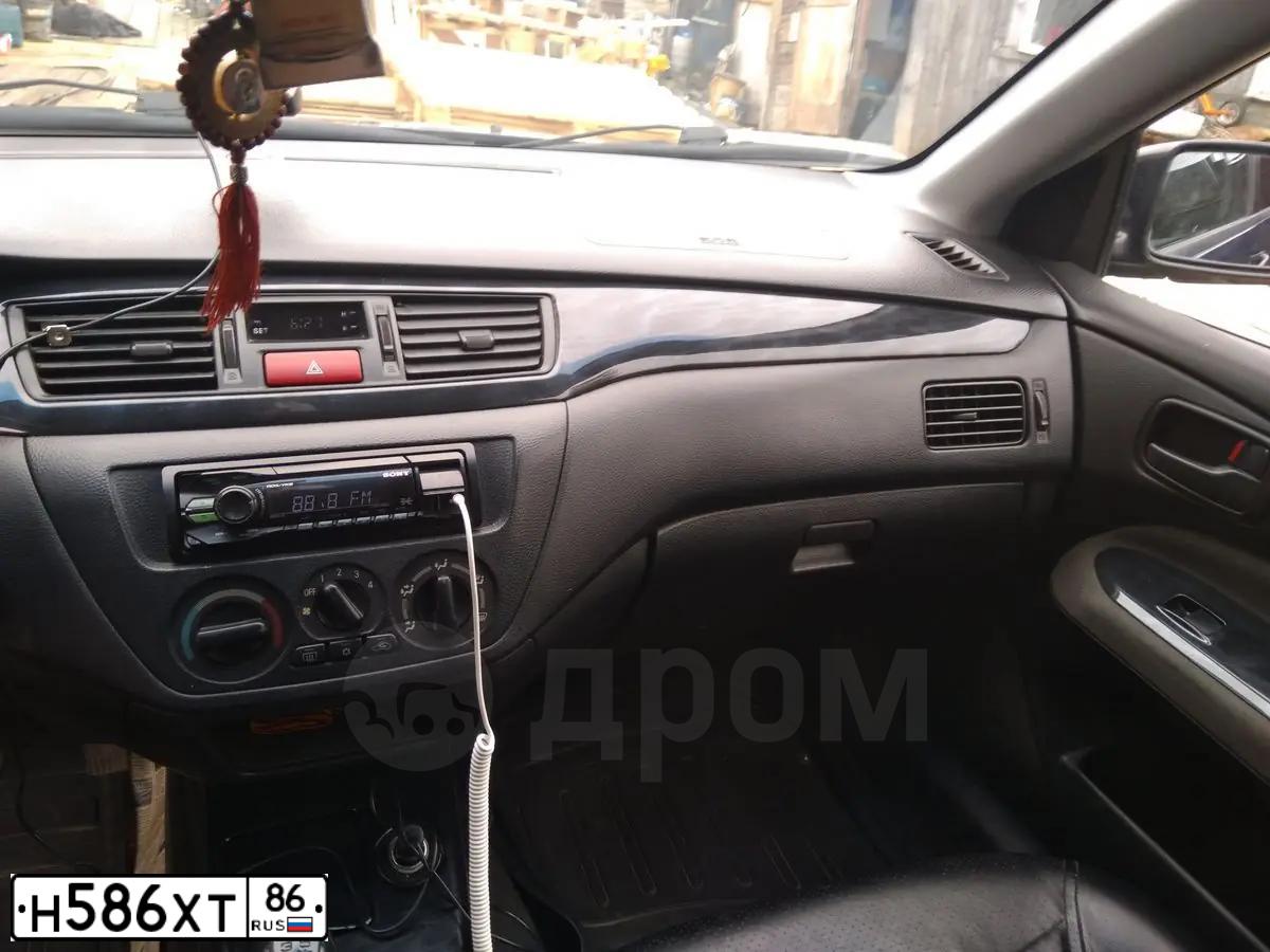 Фото автомобиля MITSUBISHI LANCER, 2004 — госномер Х495ТХ72. Цвет: синий
