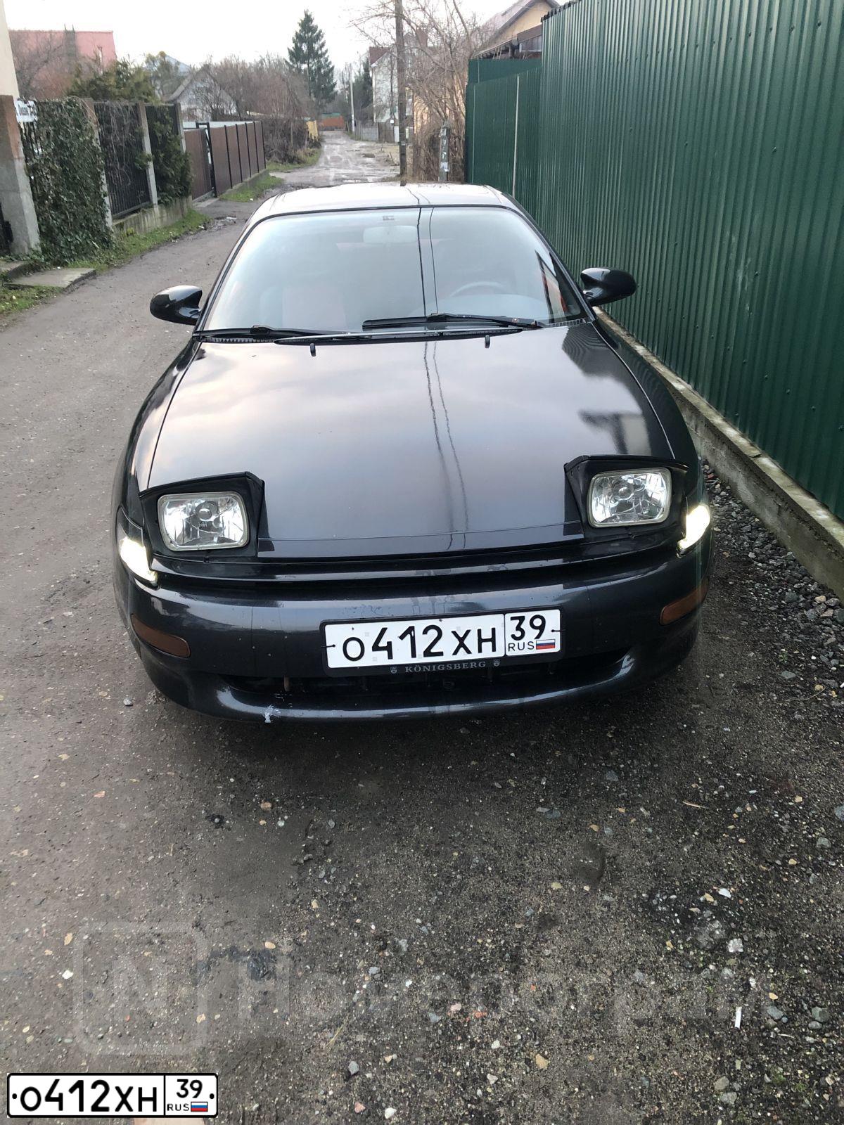 Фото автомобиля TOYOTA CELICA, 1994 — госномер О155ОЕ39. Цвет: КРАСНО-ЧЕРНЫЙ
