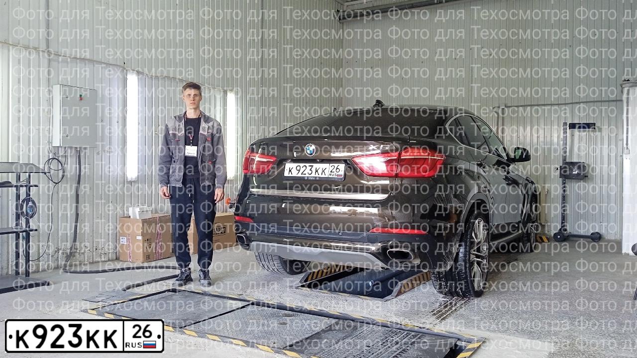 Фото автомобиля BMW X6, 2015 — госномер Н070НС761. Цвет: Коричневый