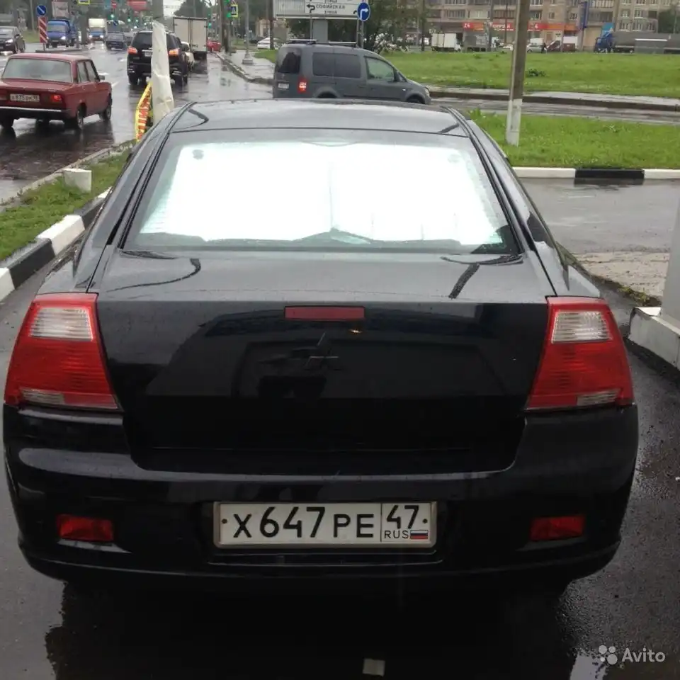 Фото автомобиля MITSUBISHI GALANT, 2006 — госномер Н110КУ10. Цвет: ЧЕРНЫЙ