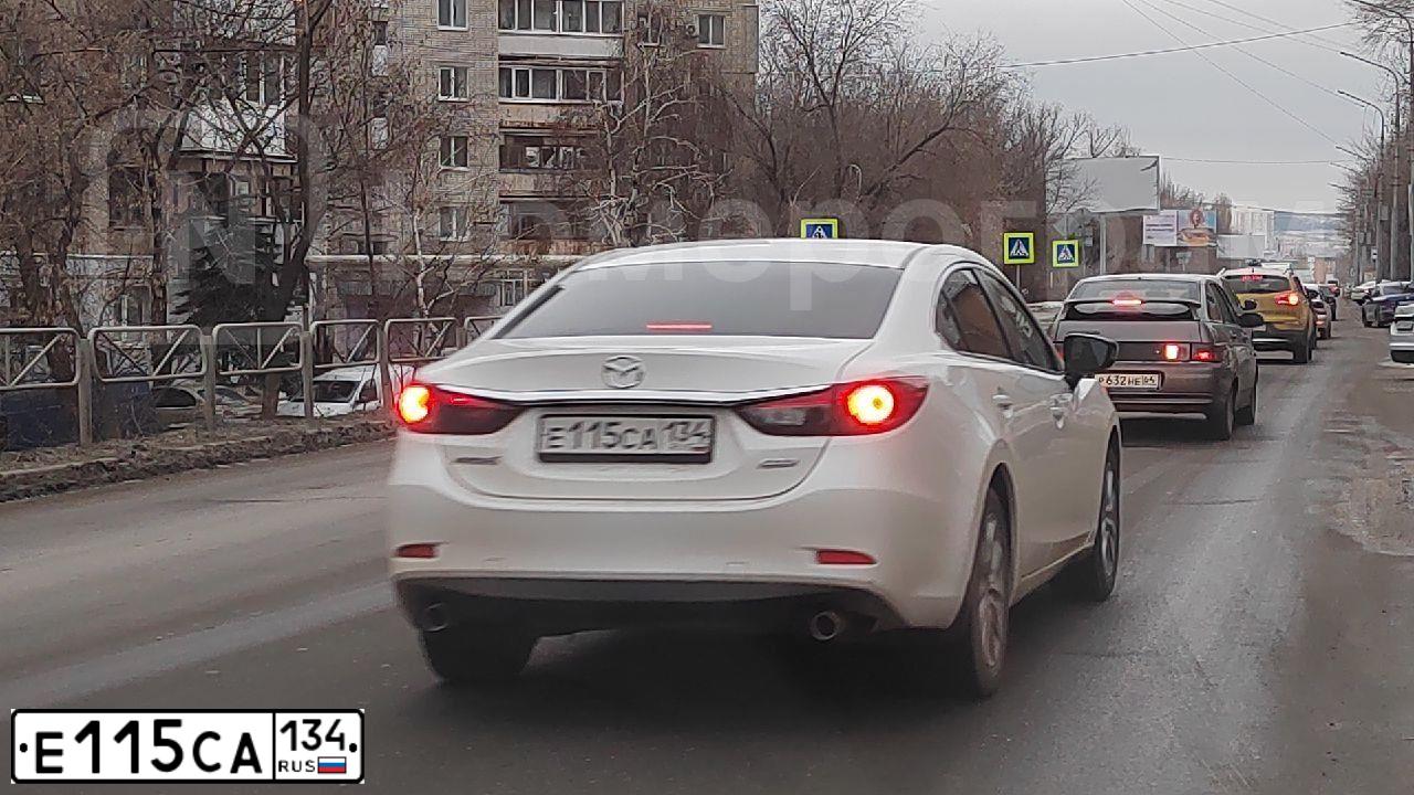 Фото автомобиля MAZDA 6, 2014 — госномер Е115СА134. Цвет: Белый