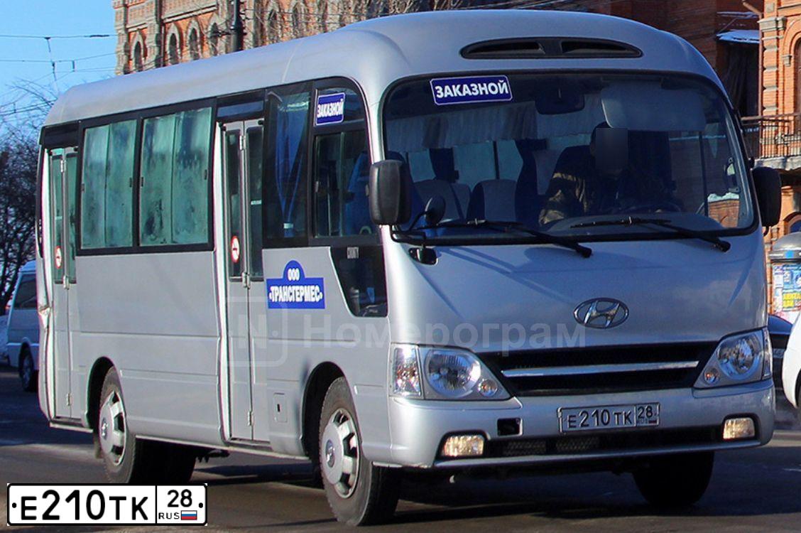 Фото автомобиля HYUNDAI COUNTY, 2010 — госномер Е210ТК28. Цвет: СЕРЫЙ
