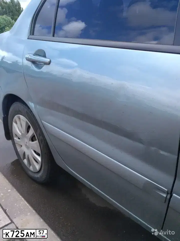 Фото автомобиля MITSUBISHI LANCER, 2006 — госномер М902ОС761. Цвет: СВЕТЛО-СЕРО-ЗЕЛЕНЫЙ