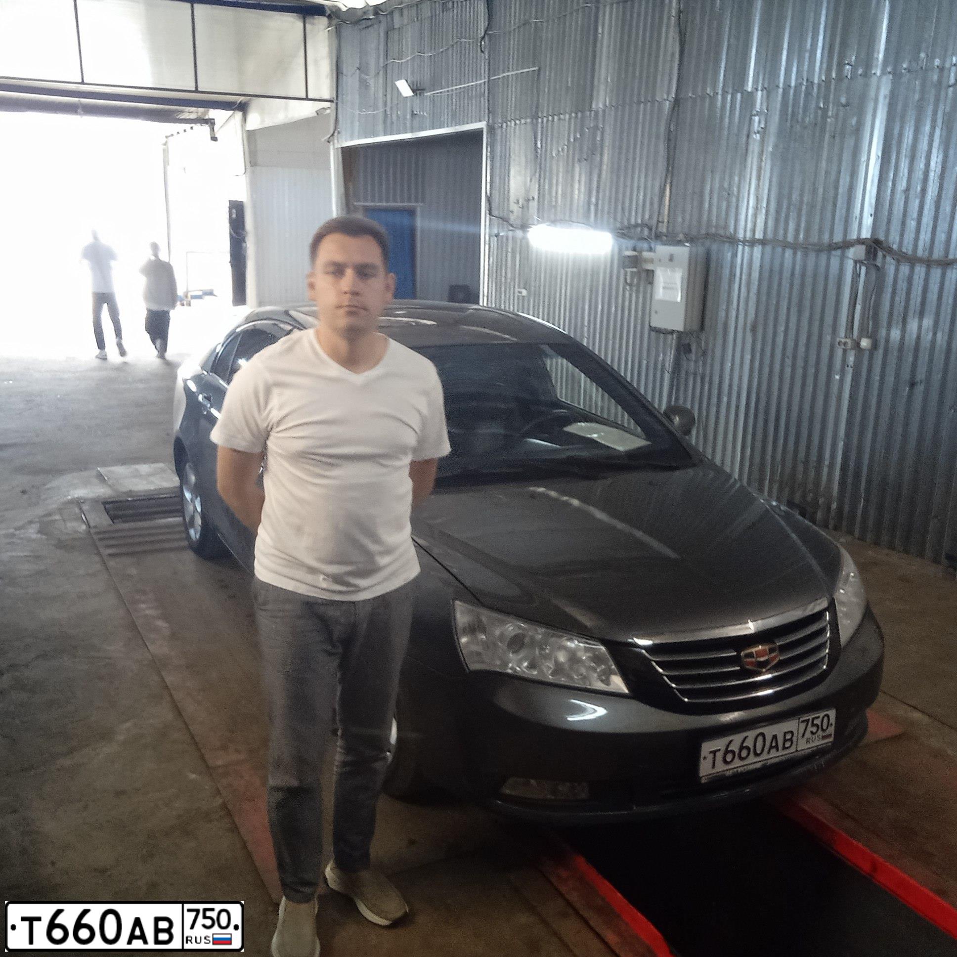 Фото автомобиля GEELY EMGRAND, 2012 — госномер К211МВ790. Цвет: СТАЛЬНОЙ СЕРЫЙ