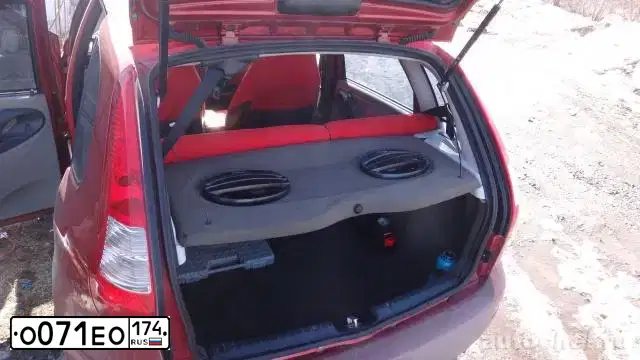 Фото автомобиля LADA 1119 KALINA, 2010 — госномер О071ЕО174. Цвет: СЕРЕБРИСТО - КРАСНЫЙ