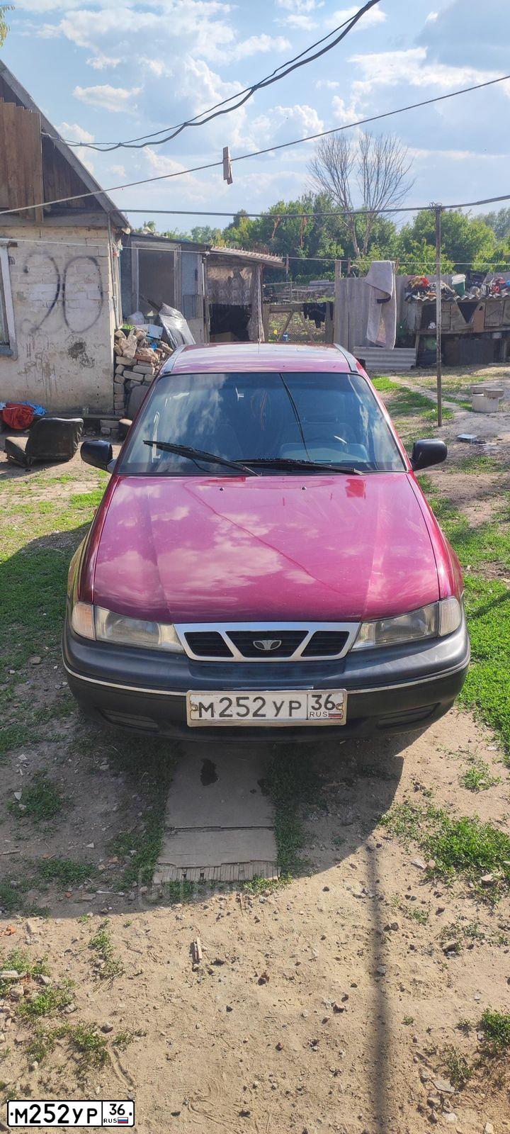 Фото автомобиля DAEWOO NEXIA, 2007 — госномер М252УР36. Цвет: СПЕЛАЯ ВИШНЯ