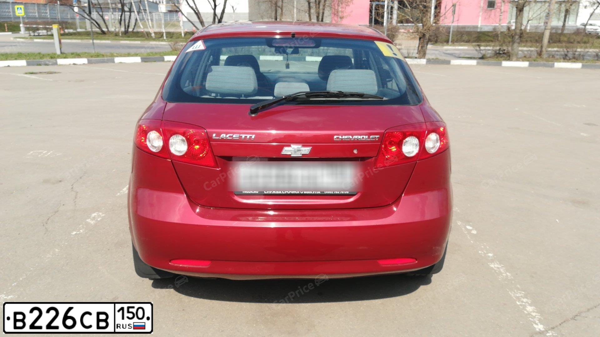 Фото автомобиля CHEVROLET LACETTI, 2008 — госномер К045РС150. Цвет: Красный