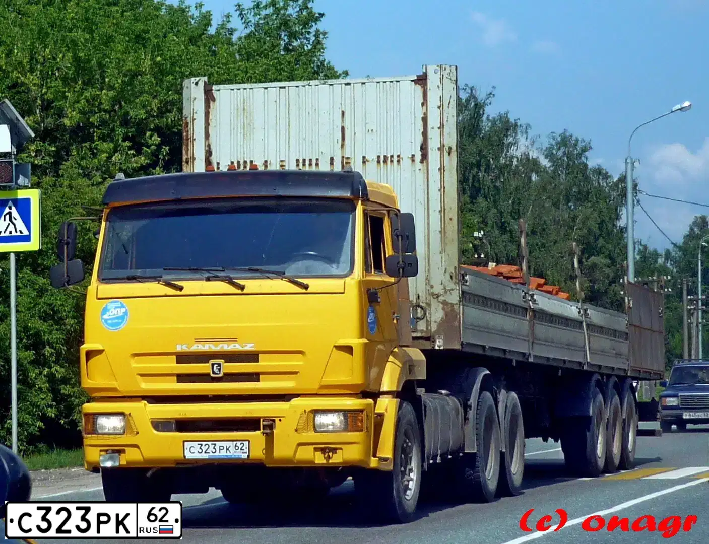 Фото автомобиля KAMAZ 65116 /6X4/, 2011 — госномер С323РК62. Цвет: ЖЕЛТЫЙ ГЕОРГИН