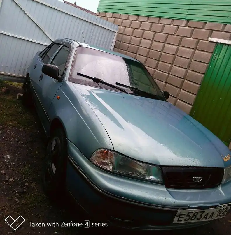 Фото автомобиля DAEWOO NEXIA, 2005 — госномер К466УУ702. Цвет: ГОЛУБОВАТО-СЕРЫЙ