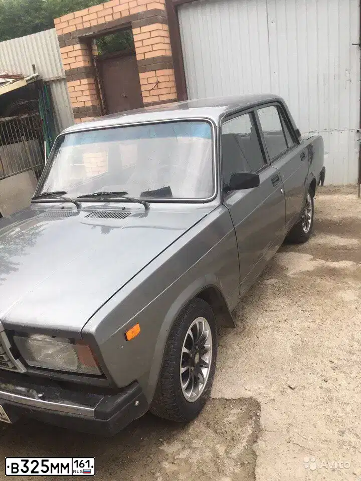 Фото автомобиля LADA 2107, 2010 — госномер В325ММ161. Цвет: СР.СЕРО-ЗЕЛЕНЫЙ МЕТ.