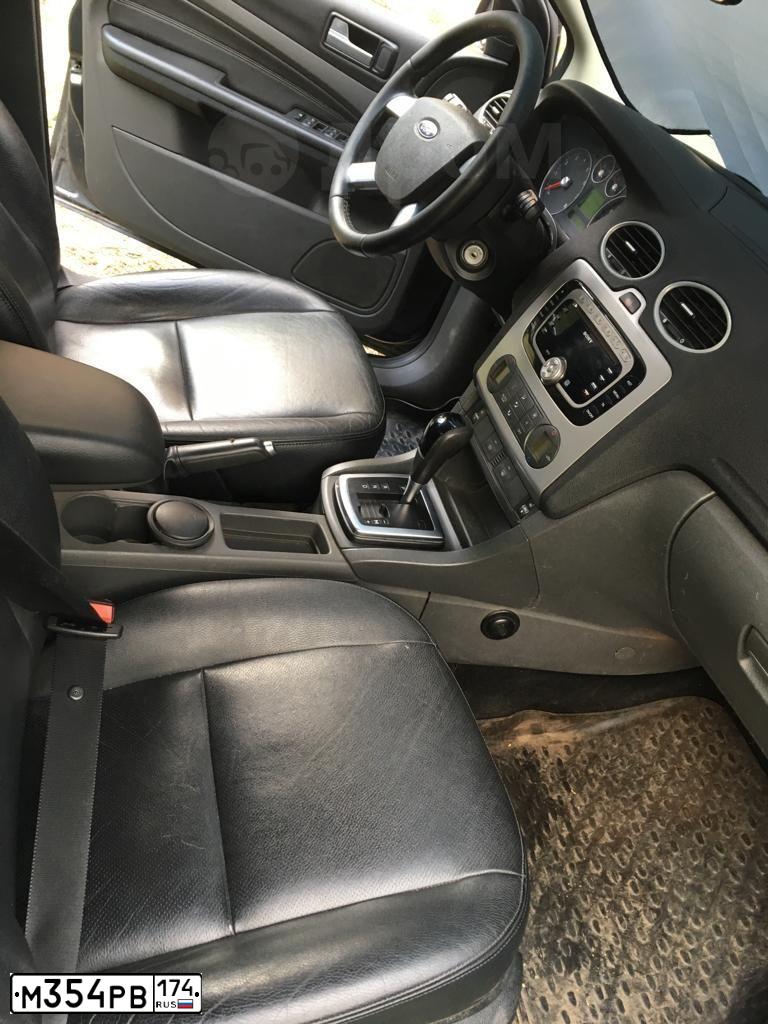 Фото автомобиля FORD FOCUS, 2007 — госномер Е144ЕЕ774. Цвет: ТЕМНО-СЕРЫЙ