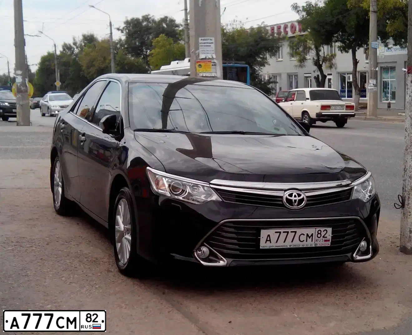 Фото автомобиля ТОЙОТА КАМРИ, 2015 — госномер А777СМ82. Цвет: ЧЕРНЫЙ МЕТАЛЛИК