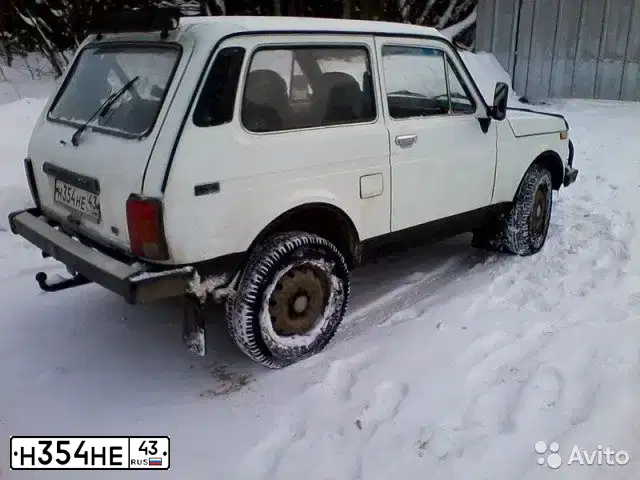 Фото автомобиля LADA 2121 NIVA, 1997 — госномер Н354НЕ43. Цвет: БЕЛЫЙ