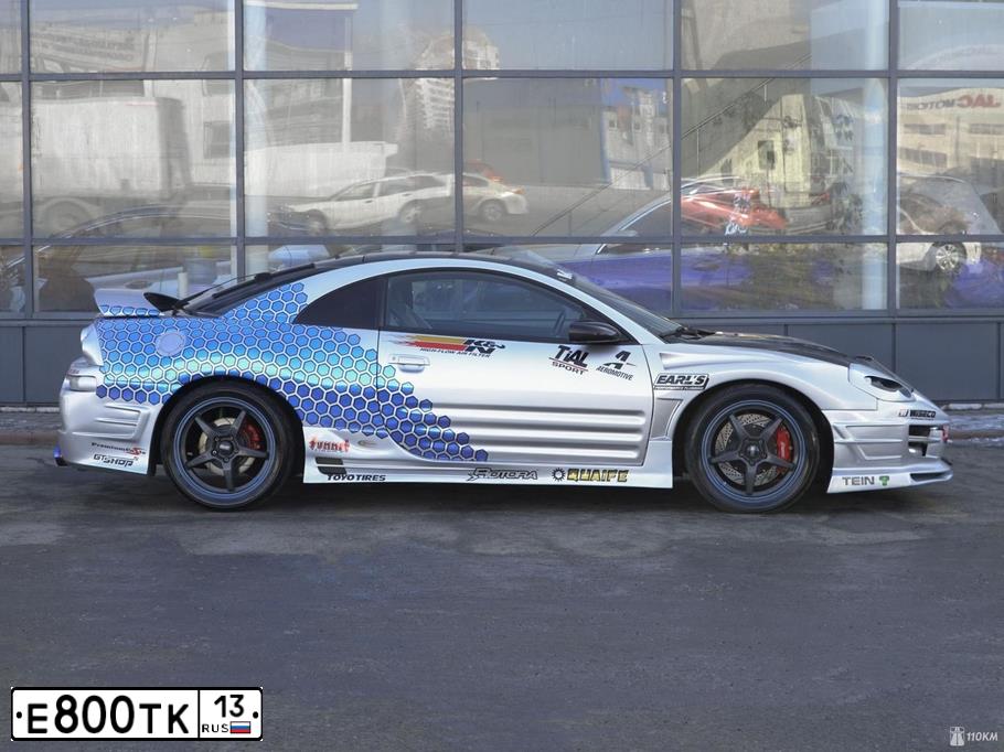Фото автомобиля MITSUBISHI ECLIPSE, 2001 — госномер Н331АС13. Цвет: МНОГОЦВЕТНЫЙ