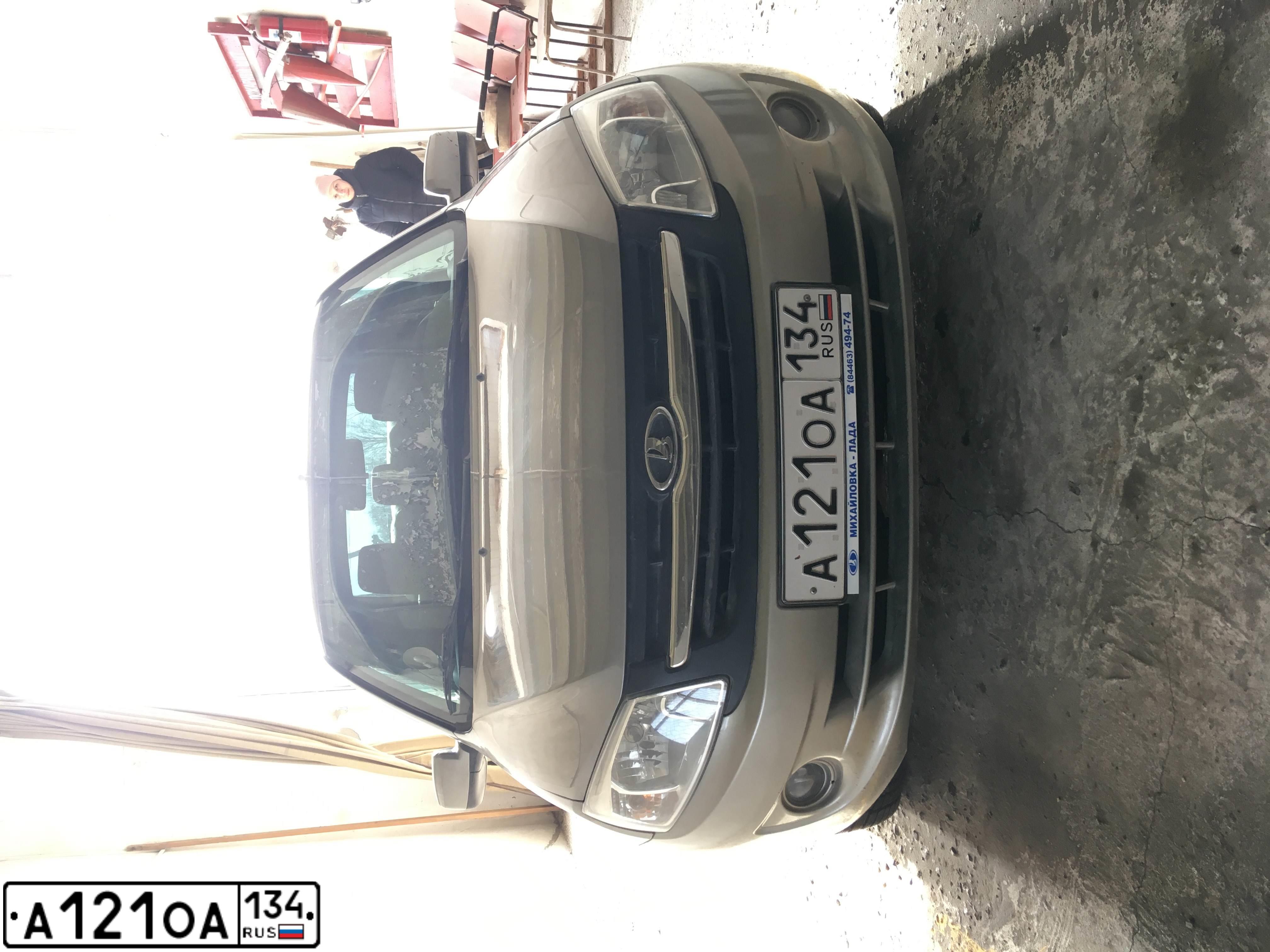 Фото автомобиля LADA 2190 GRANTA, 2013 — госномер А121ОА134. Цвет: СЕРО БЕЖЕВЫЙ