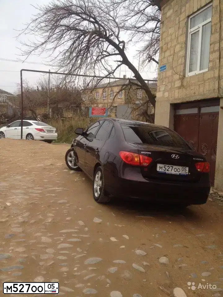 Фото автомобиля HYUNDAI ELANTRA, 2010 — госномер М767ОТ86. Цвет: ВИШНЕВЫЙ