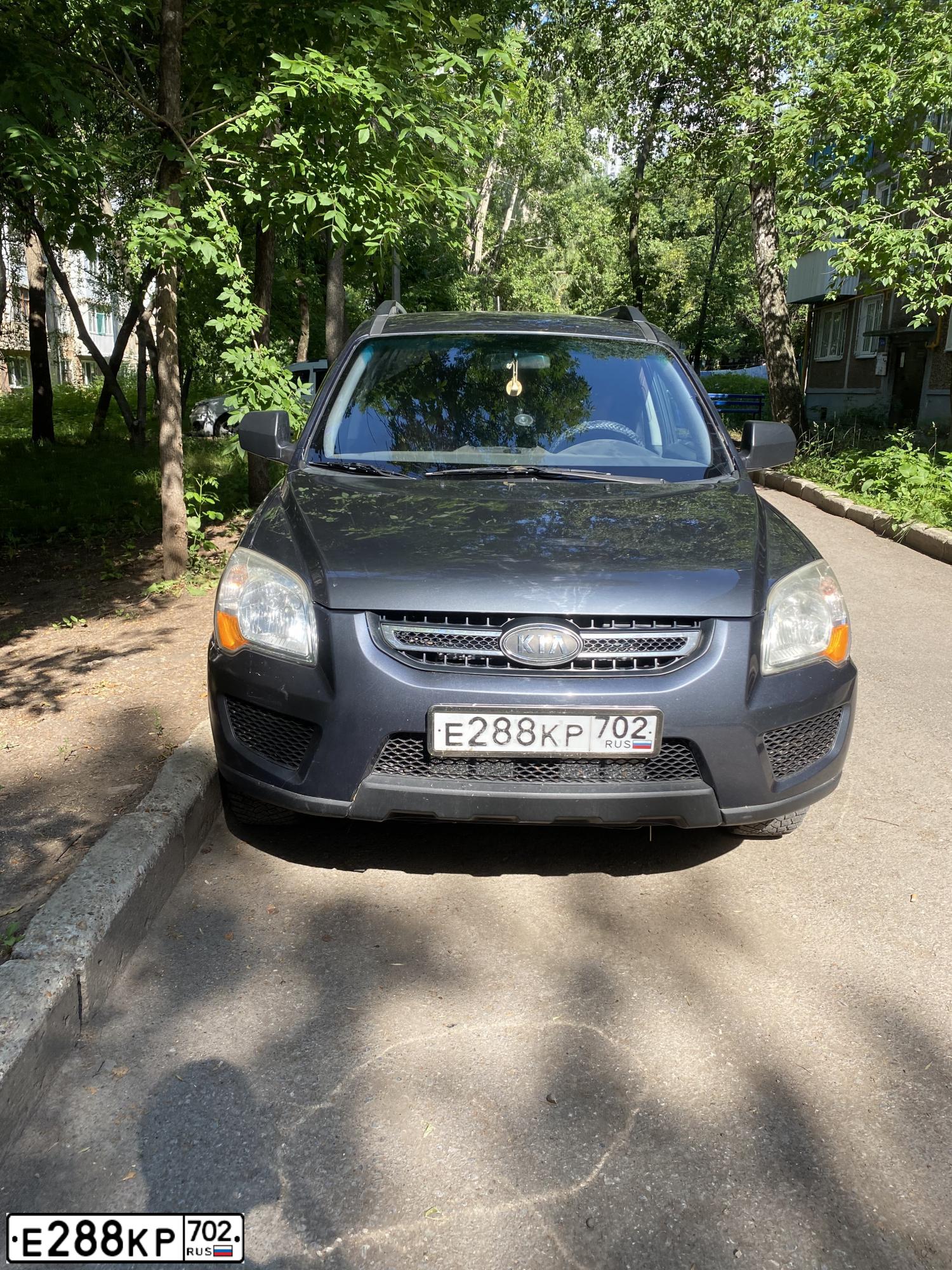 Фото автомобиля KIA SPORTAGE, 2009 — госномер О146ВВ702. Цвет: Серый