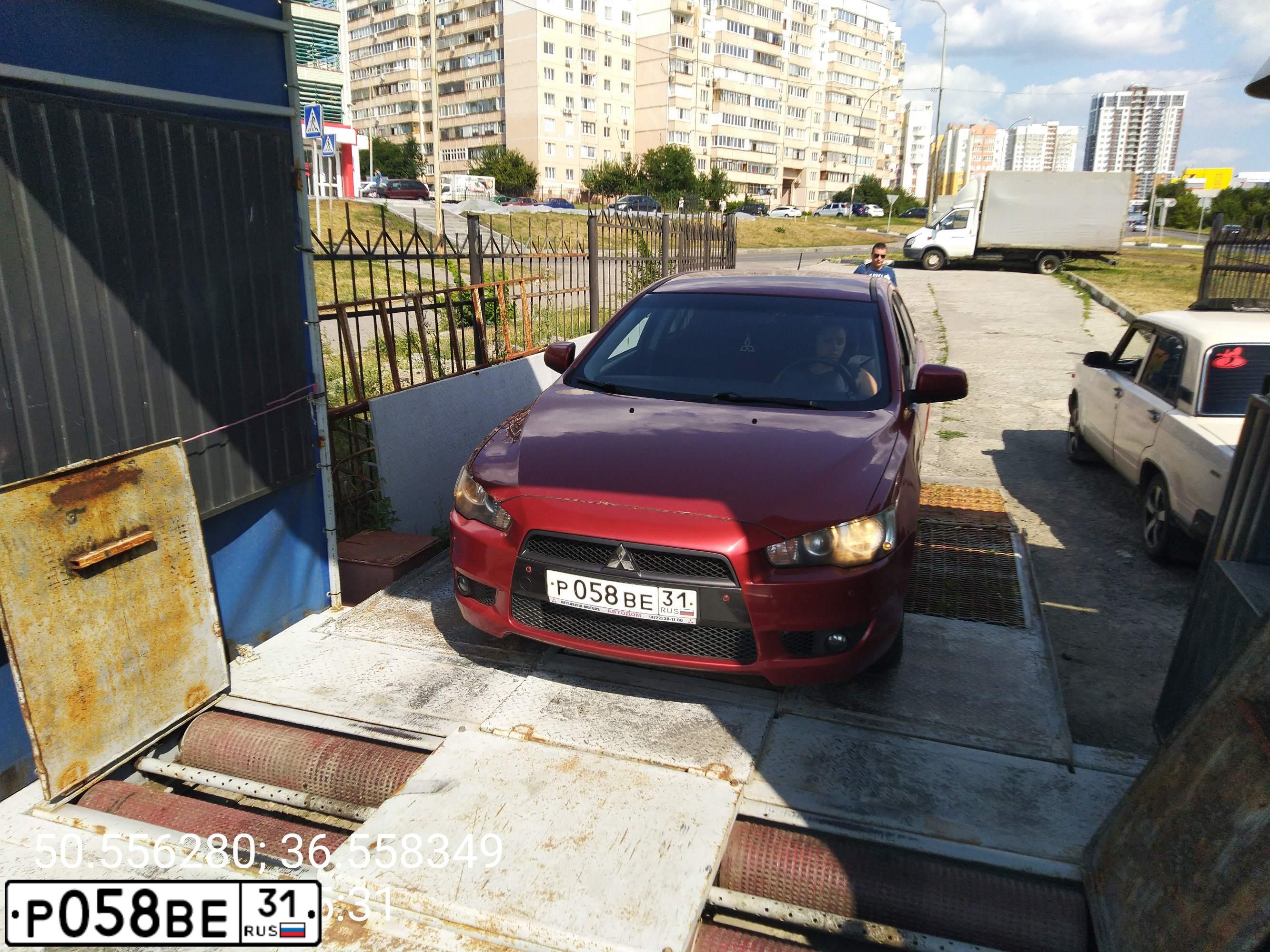 Фото автомобиля MITSUBISHI LANCER, 2007 — госномер Р058ВЕ31. Цвет: КРАСНЫЙ