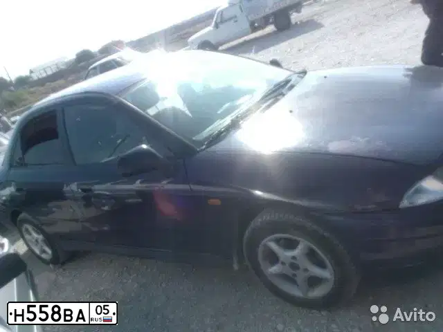 Фото автомобиля MITSUBISHI CARISMA, 1997 — госномер Р344МР05. Цвет: синий