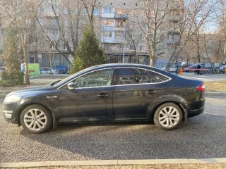 Фото автомобиля FORD MONDEO, 2012 — госномер Е335МЕ977. Цвет: ЧЕРНЫЙ
