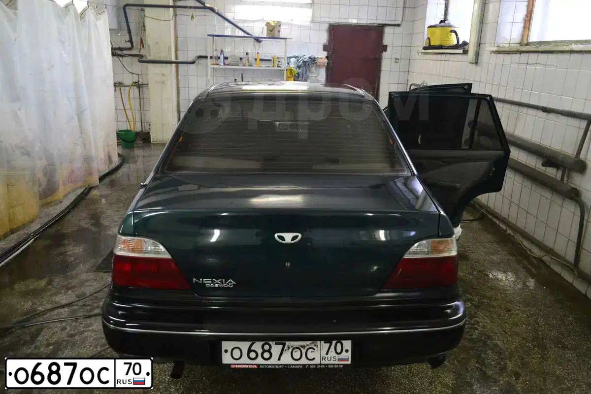 Фото автомобиля DAEWOO NEXIA, 1998 — госномер О687ОС70. Цвет: ЗЕЛЕНЫЙ