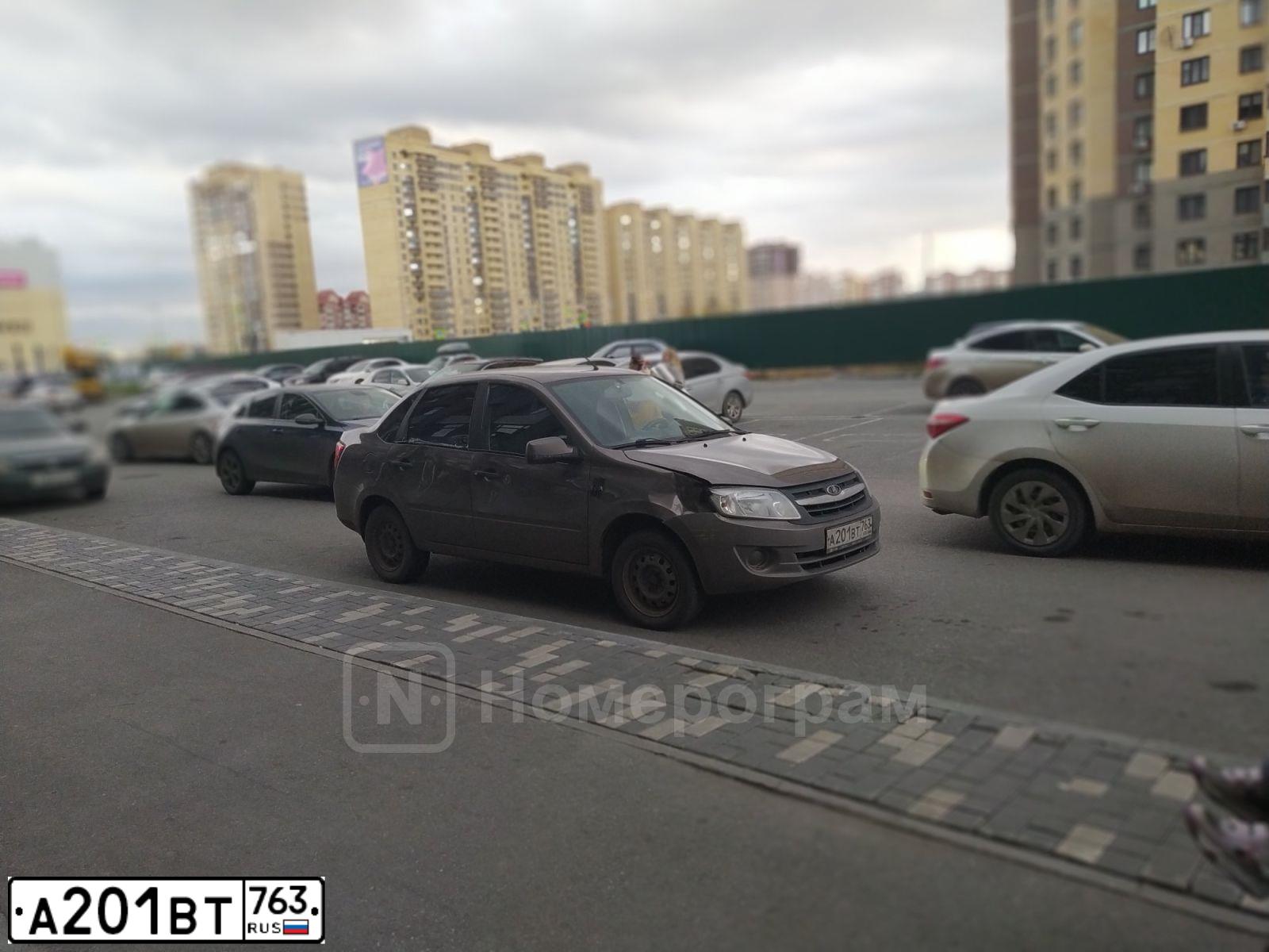 Фото автомобиля LADA 2190 GRANTA, 2013 — госномер А201ВТ763. Цвет: Золотисто-коричневый